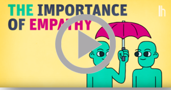 Screenshot from video "The Importance of Empathy." Two green figures stand side by side under an umbrella held by one of the figures.