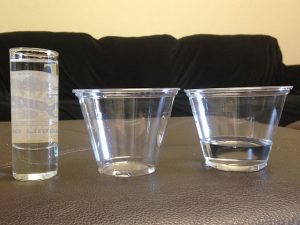 Two short wide glasses and one tall narrow glass.