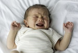 photo of a newborn crying