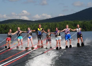 Eight members of a family waterskiing together