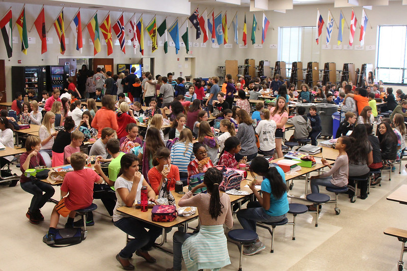 A middle school cafeteria at lunch time filled with students