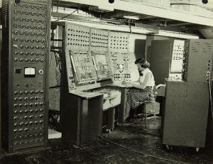 Photograph of woman at 1950's computer